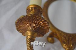 An antique French heavy bronze mirrored wall sconce, ribbon decoration