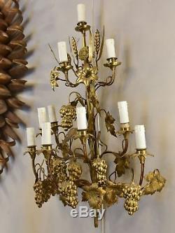 Large pair of gold wall sconces with grapes and vine leaves
