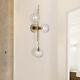 Mid-Century Modern Gold 3-Light Globe Wall Sconce Clear Glass Bedroom Decor Lamp