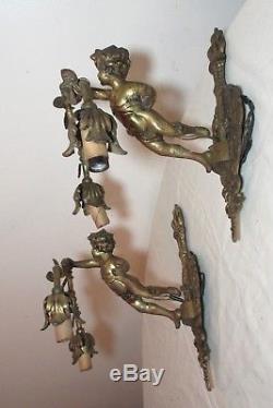Pair antique ornate gilt bronze figural cherub putti electric wall sconce brass